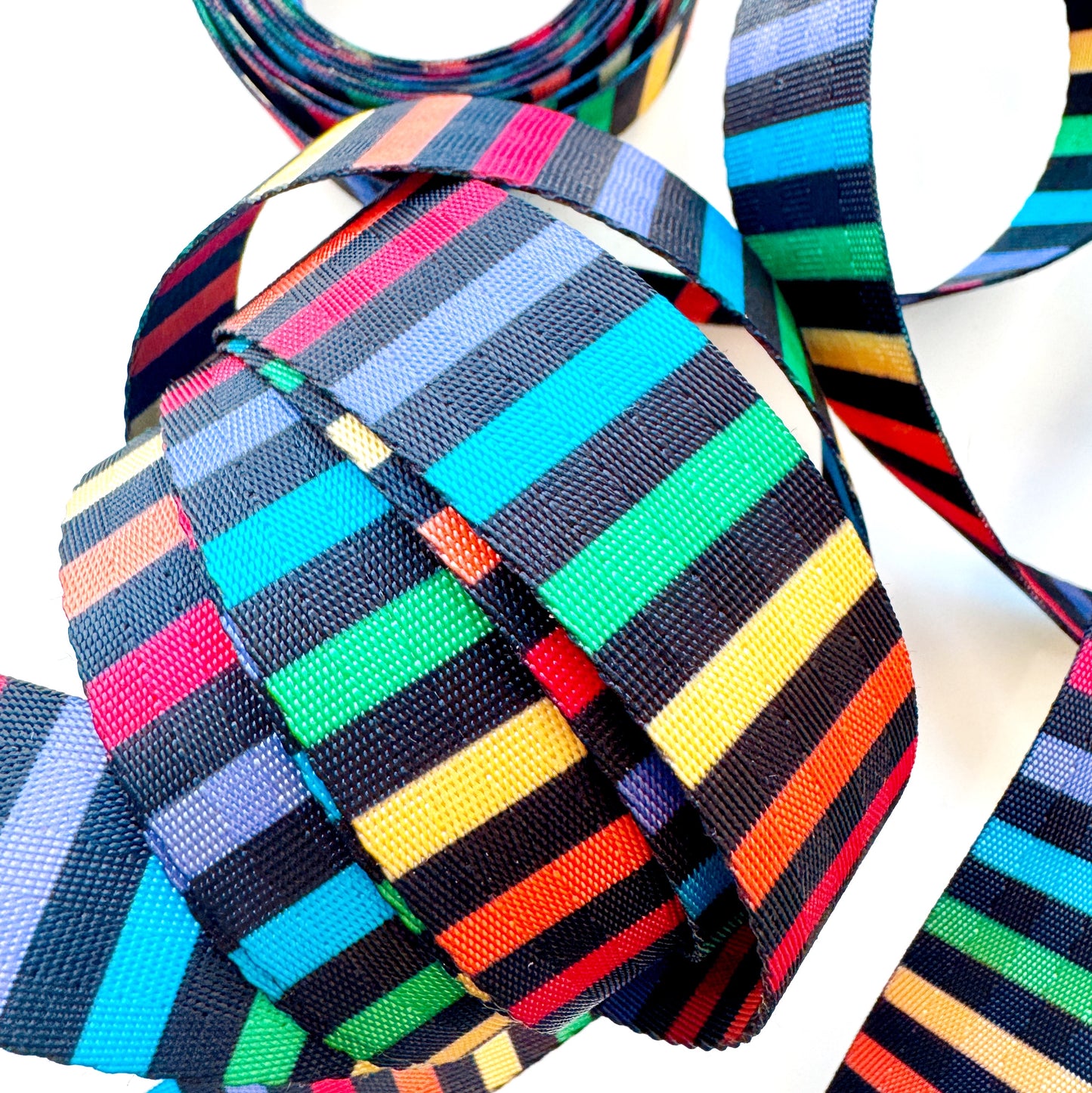 Colorful stripedseatbelt webbing with a white background
