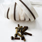 Cream #5 continuous zipper tape with antique brass zipper teeth and coordinating antique brass zipper pulls for handbags, wallets, backpacks, pouches, and sewing projects.