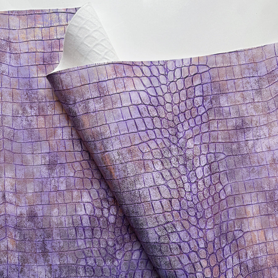 Purple textured fabric with a white border
