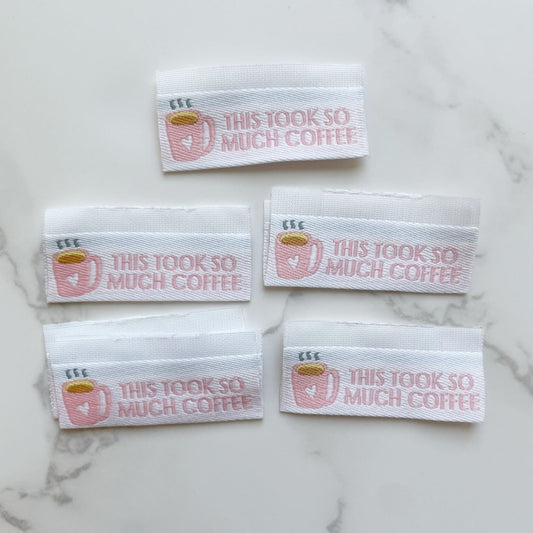 Five fabric labels with text This took so much coffee.