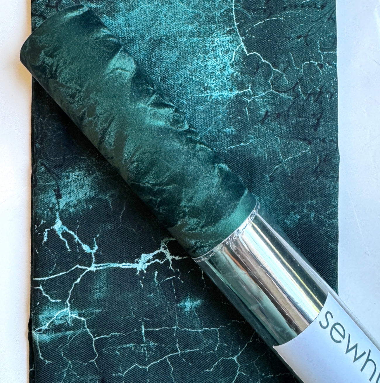 Dark emerald velveteen paired with coordinating black and teal marble cotton fabric, perfect for handbags, wallets, totes, backpacks, home décor, and sewing projects.