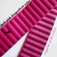 Close-up of pink webbing straps labeled 'dark pink dragonfruit color' and 'regular pink color'.