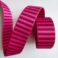 Pink strapping with a striped pattern on a white background