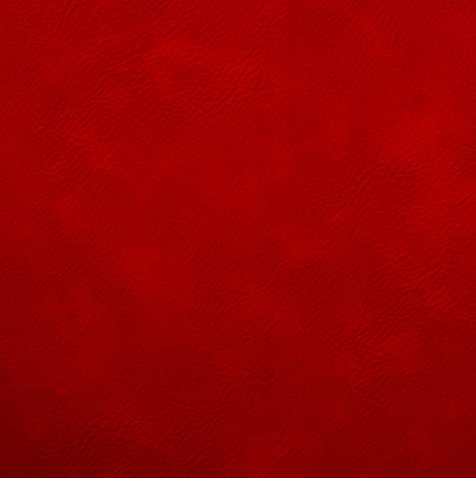 Close-up of deep red faux leather material featuring a fine natural grain texture with subtle crimson and burgundy color variations.