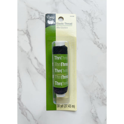 Black elastic thread spool