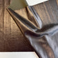 Metallic bronze and pewter fabric sheet with a shiny textured finish