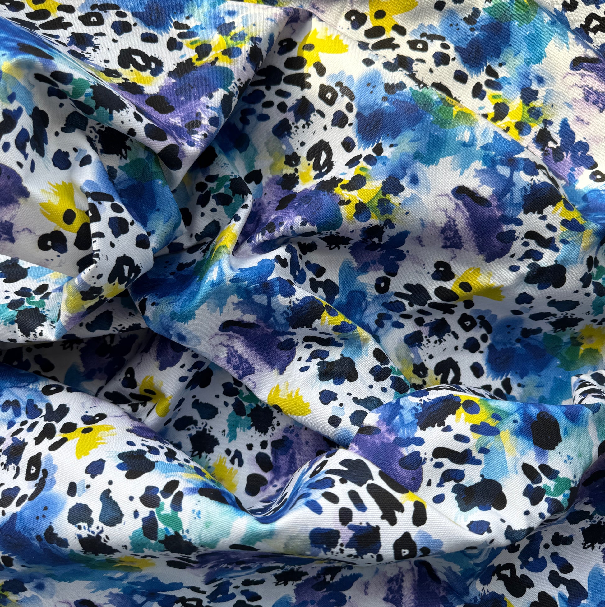 Multicolored fabric with abstract pattern on a white background
