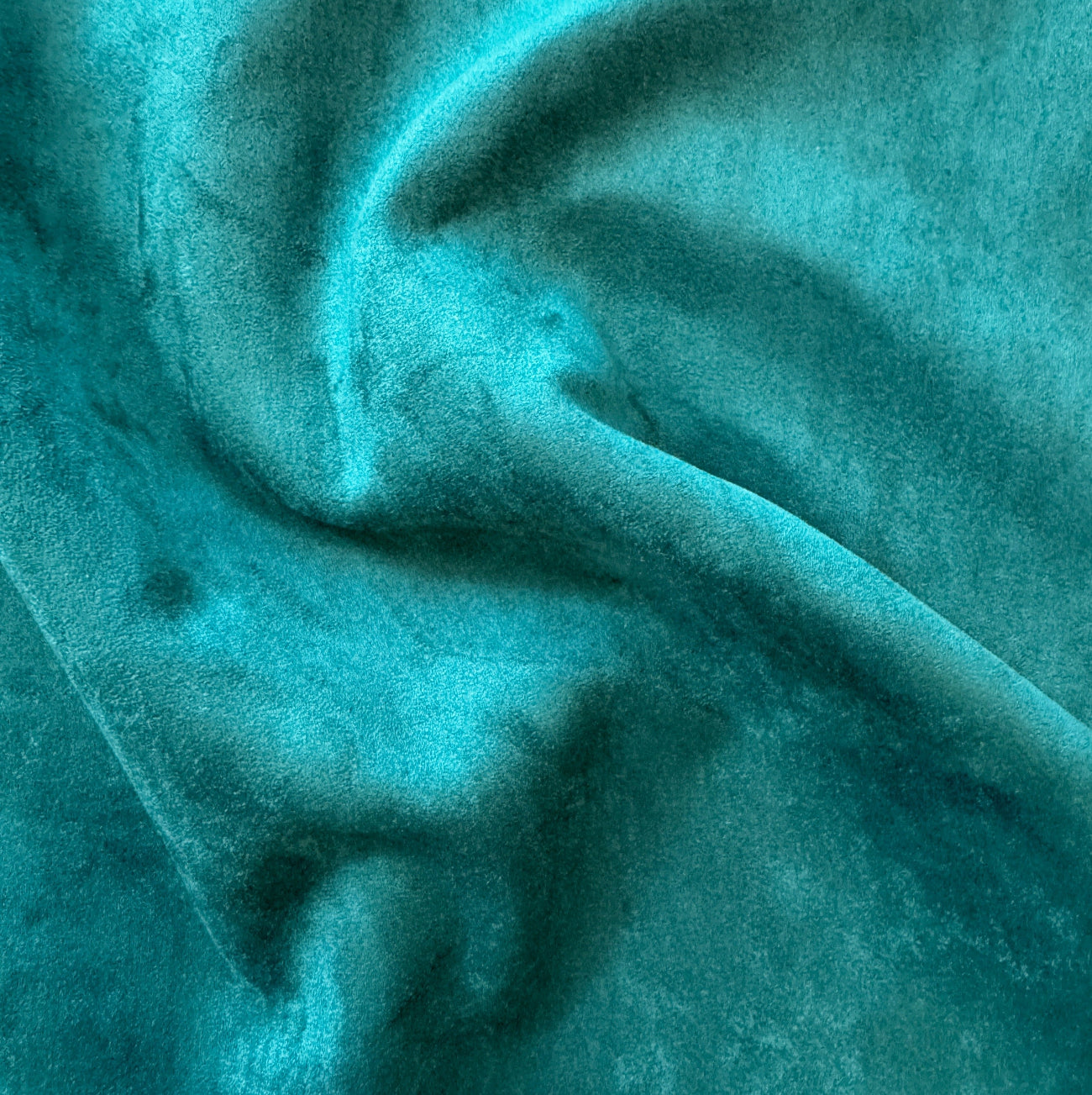 Close-up of teal fabric texture