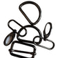 A set of five black metal hardware accessories, including carabiners, clips, and a rectangular buckle, arranged on a plain white surface.