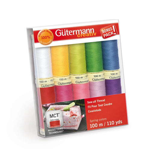 Gutermann thread set with colorful spools in a packaging on a white background
