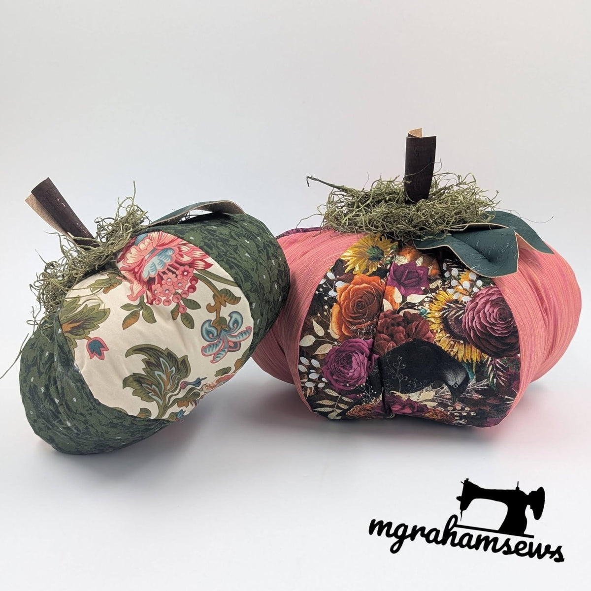 Handmade patchwork fabric pumpkins with floral and textured panels, faux stems, moss, and green fabric leaves for autumn decor