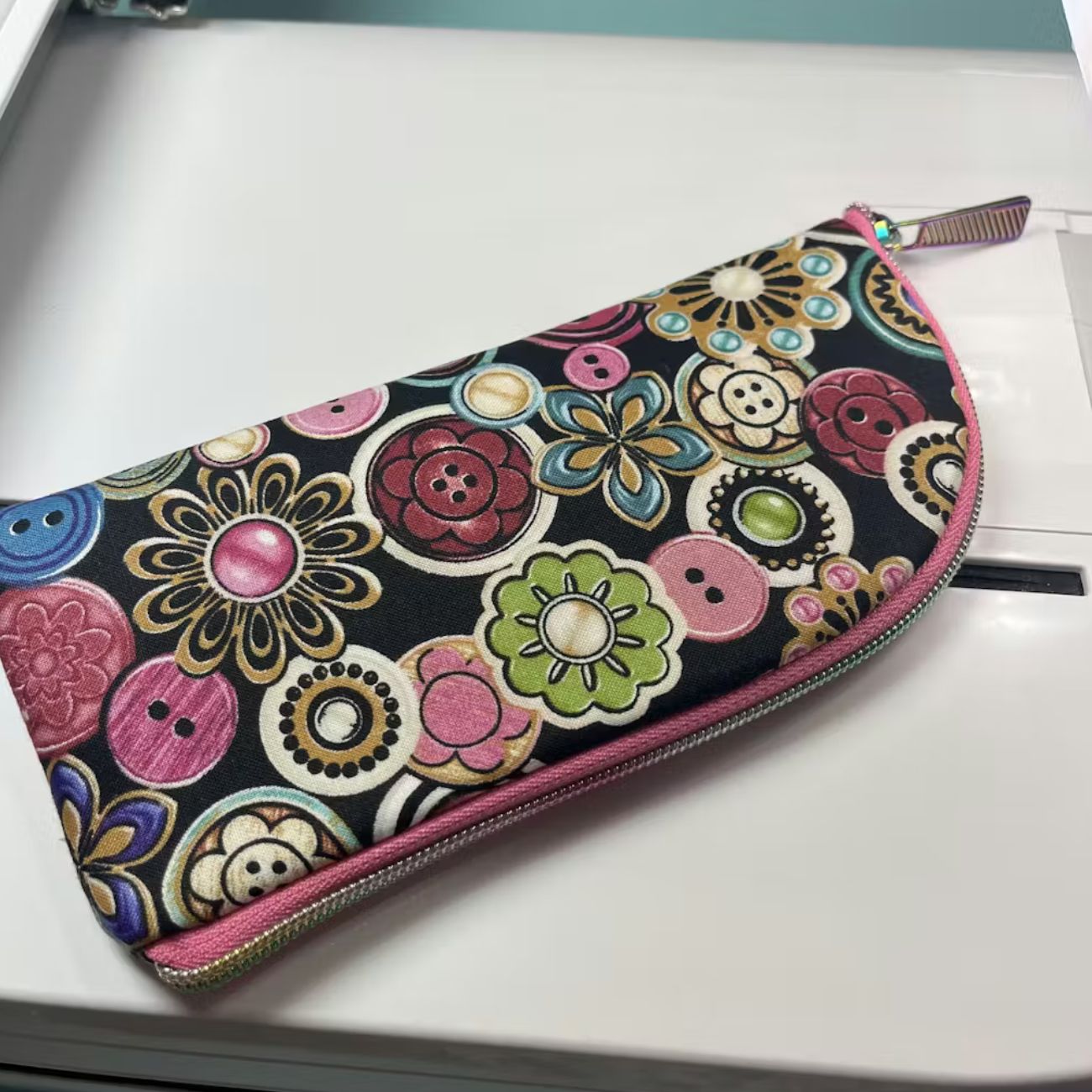 Digital PDF sewing pattern for the Hippie Specs Case displayed on a tablet screen, featuring printable pattern pieces, cutting layouts, and step-by-step illustrated instructions.