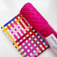 Hot pink quilted vinyl paired with coordinating modern geometric cotton fabric in pink, red, yellow, purple, and blue, perfect for handbags, totes, wallets, pouches, and bag making projects.