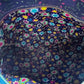 Colorful star pattern on a dark background
