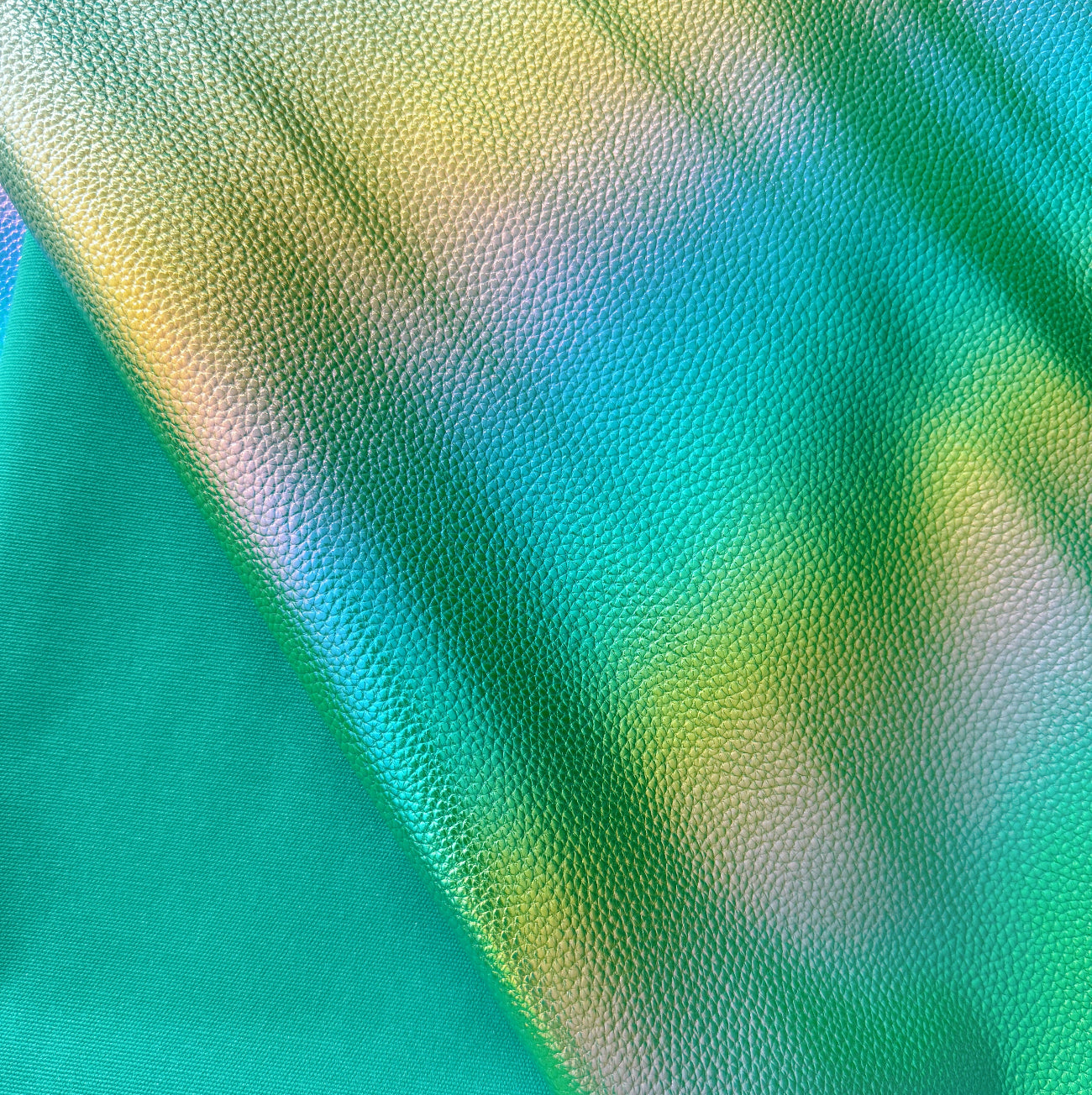 Close-up of a textured fabric with green and blue colors