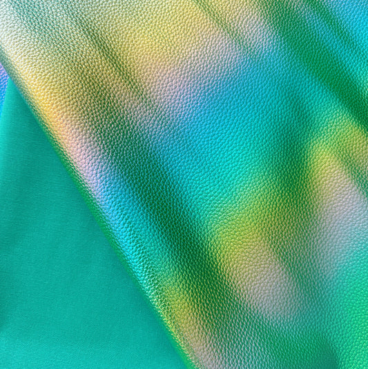 Close-up of a textured fabric with green and blue colors