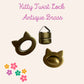 Kitty Turn Lock twist lock antique brass