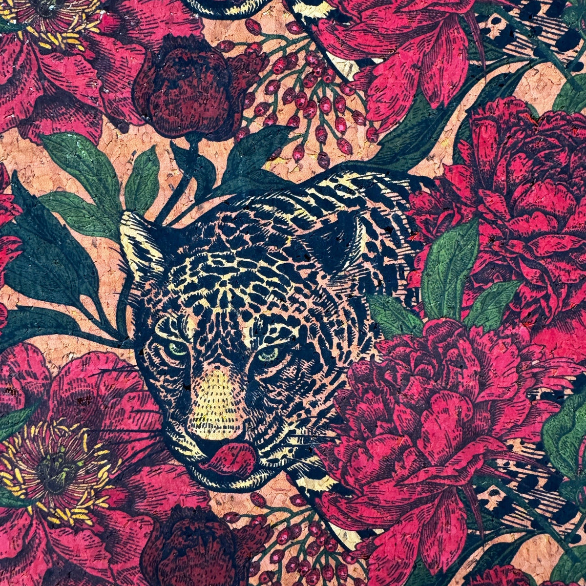 Patterned fabric with leopards and red flowers on a textured background