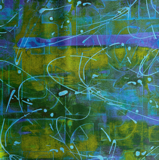 Close-up flat lay of an abstract print fabric featuring a layered green, yellow, and purple pattern with light blue graphic lines.