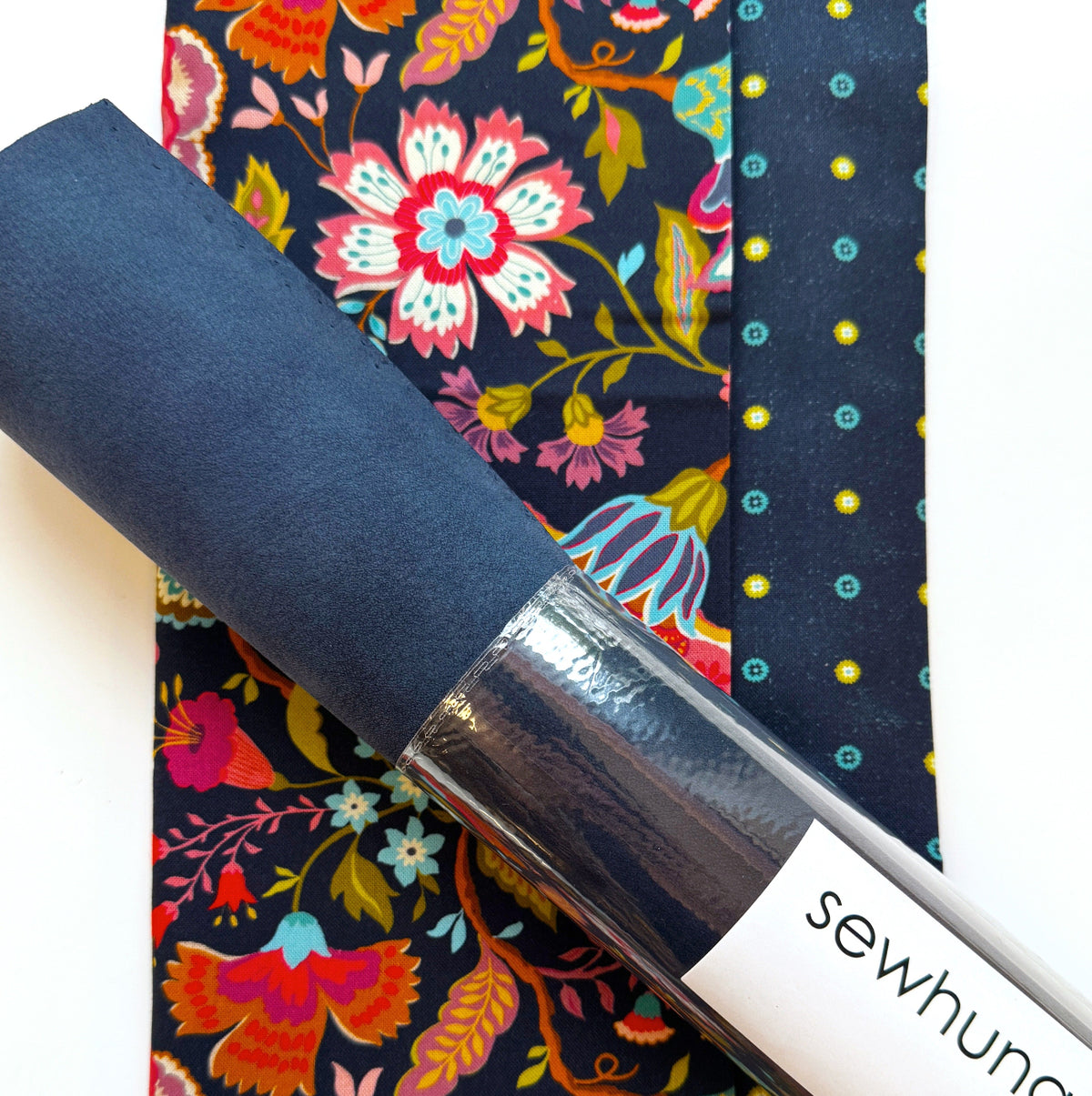 Moda fabric bundle with 2 yards of navy boho floral and coordinating dot-print quilting cotton, paired with navy Almost Leather for bag making