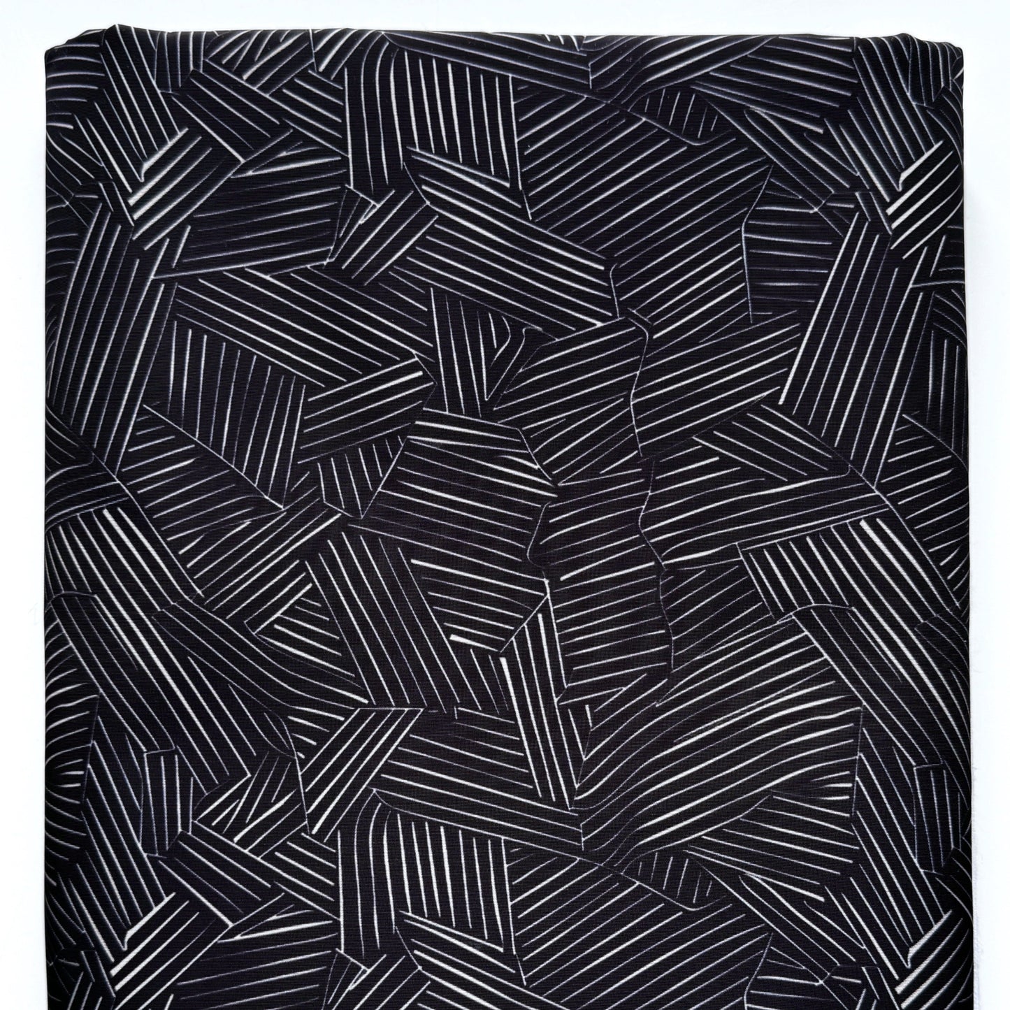 Black fabric with geometric pattern on a white background