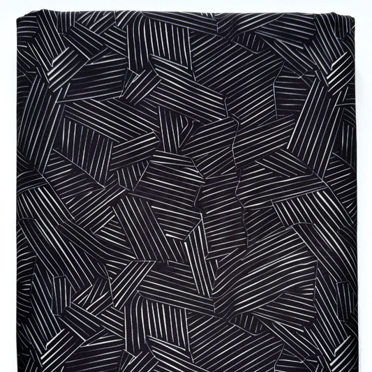 Black fabric with geometric pattern on a white background