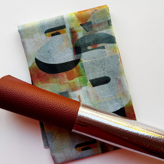 Moonglow Butterscotch faux leather vinyl in light brown with a coordinating abstract mid-century modern fabric featuring bold black geometric shapes and a muted background, ideal for DIY bag making and handmade accessories.