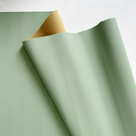 Moonglow New Sage pebbled vinyl faux leather fabric with textured surface