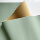 Moonglow New Sage pebbled vinyl faux leather fabric with soft brown-beige brushed backing