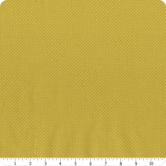 Mystic Fable Pistachio Mini Dot fabric features a vibrant greenish-yellow pistachio background patterned with tiny, subtle dots.