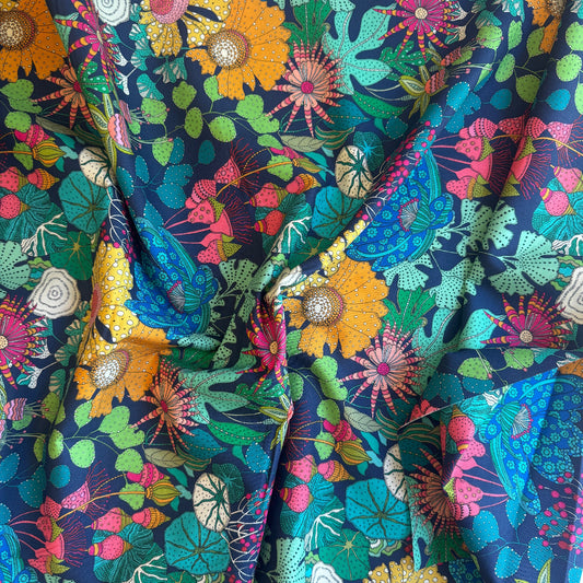 Colorful floral fabric with a dark blue background
