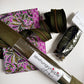 Olive suede vinyl paired with purple floral cotton fabric, coordinating zippers, and bag hardware for sewing handbags, crossbody bags, and handmade accessories.