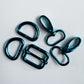 a set of turquoise metallic bag-making hardware pieces used for straps, purses, and DIY sewing projects.