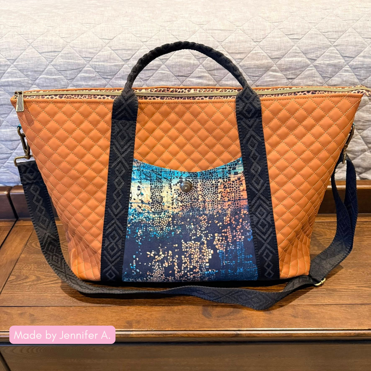 Handmade Oxbow Tote bag crafted from light brown pre-quilted diamond vinyl, featuring a textured abstract mosaic Tim Holtz fabric outer pocket with a metal snap closure and black geometric diamond jacquard webbing straps