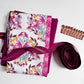 Pink floral cotton fabric bundle with coordinating solid fabric, rose gold zipper, and zipper pulls for sewing handbags, pouches, and handmade accessories.