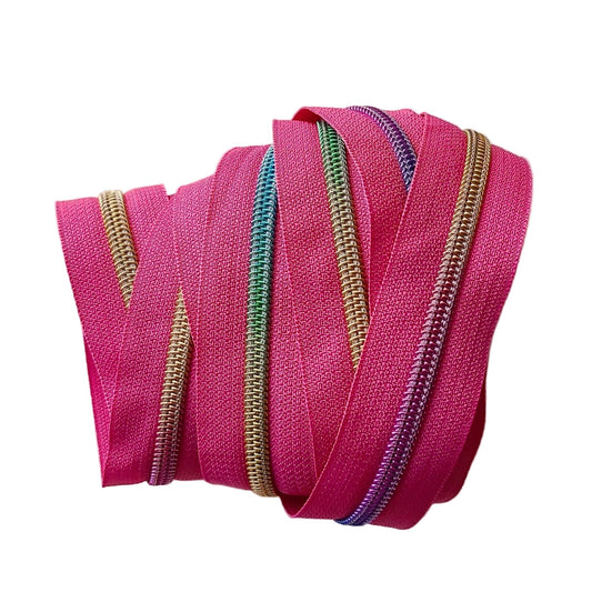 Pink and rainbow colored zipper on white background.