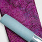 Light blue cork fabric paired with purple batik dot cotton fabric for sewing handbags, wallets, totes, and handmade accessories.