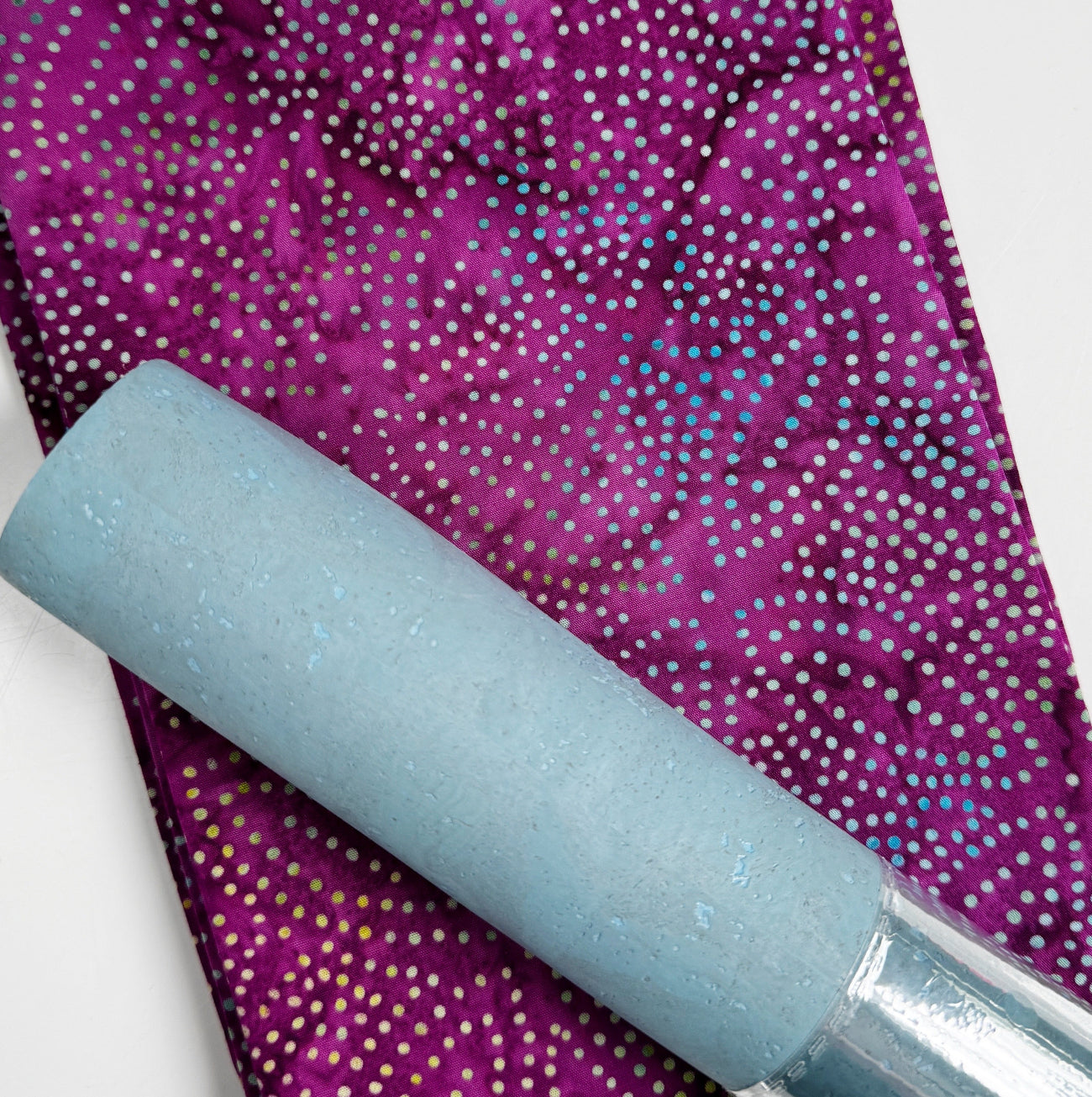 Light blue cork fabric paired with purple batik dot cotton fabric for sewing handbags, wallets, totes, and handmade accessories.