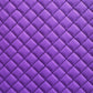 Close-up of purple quilted fabric with diamond pattern