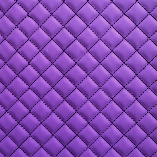 Close-up of purple quilted fabric with diamond pattern