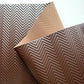 Brown textured vinyl with a geometric pattern on a white background