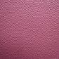 Close-up of a textured pink leather surface