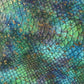 Close-up video of teal and blue embossed serpent vinyl with a scale texture and gold foil accents. 