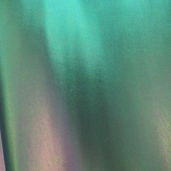 Video of high-quality iridescent green synthetic leather material with a smooth, reflective surface for bags