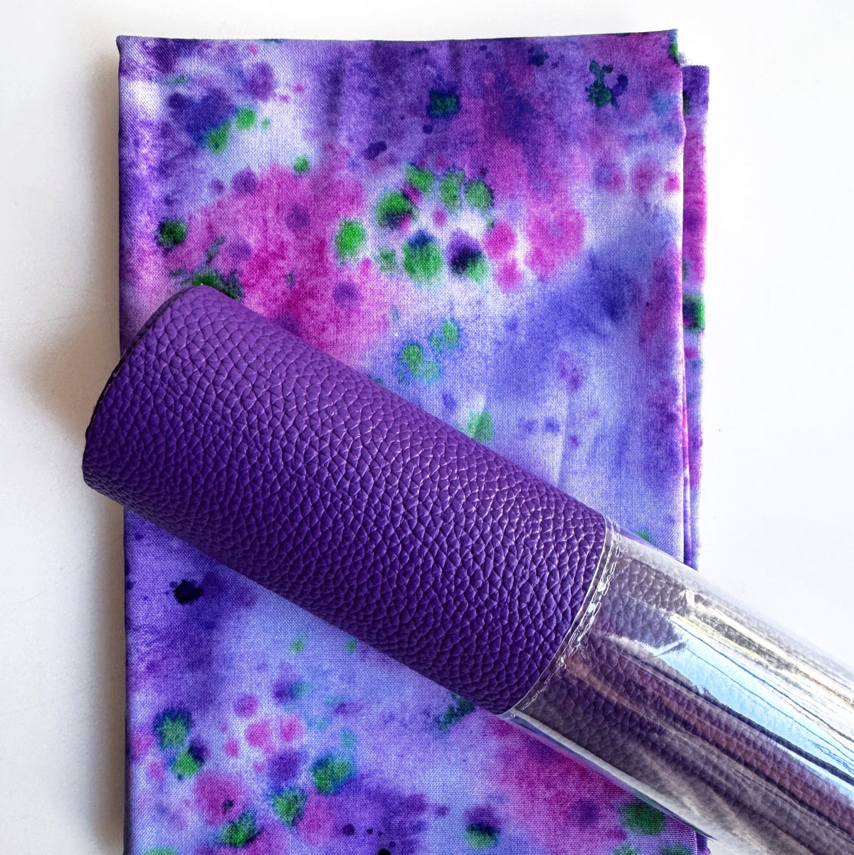 Purple textured vinyl paired with purple and pink watercolor floral fabric for bag making
