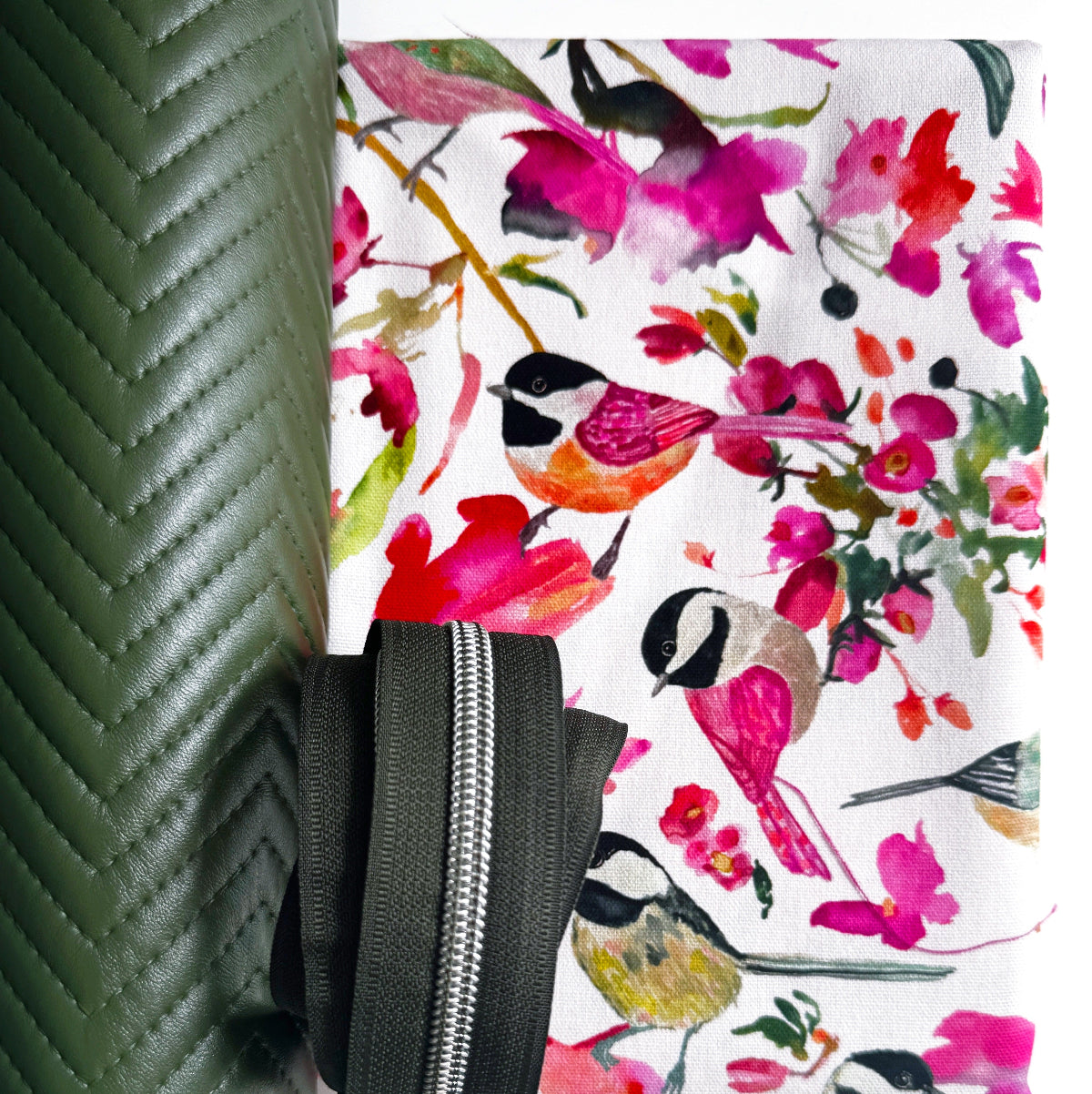 Floral and bird patterned product with a green textured background