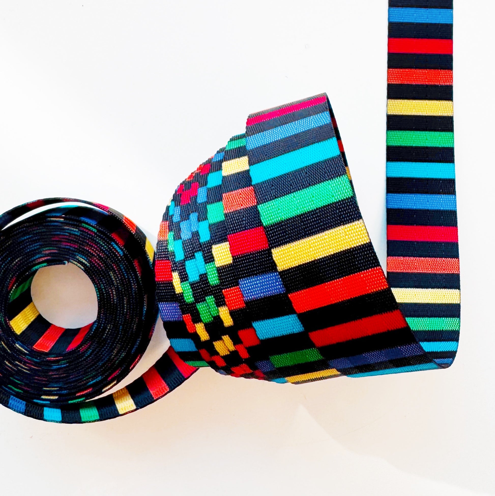 Colorful striped webbing on a white background