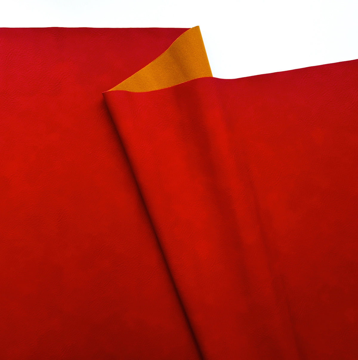 red faux leather or vinyl fabric with a smooth matte finish, featuring a diagonal fold that reveals a contrasting orange-gold underside against a white background