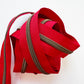 red zipper on a white background