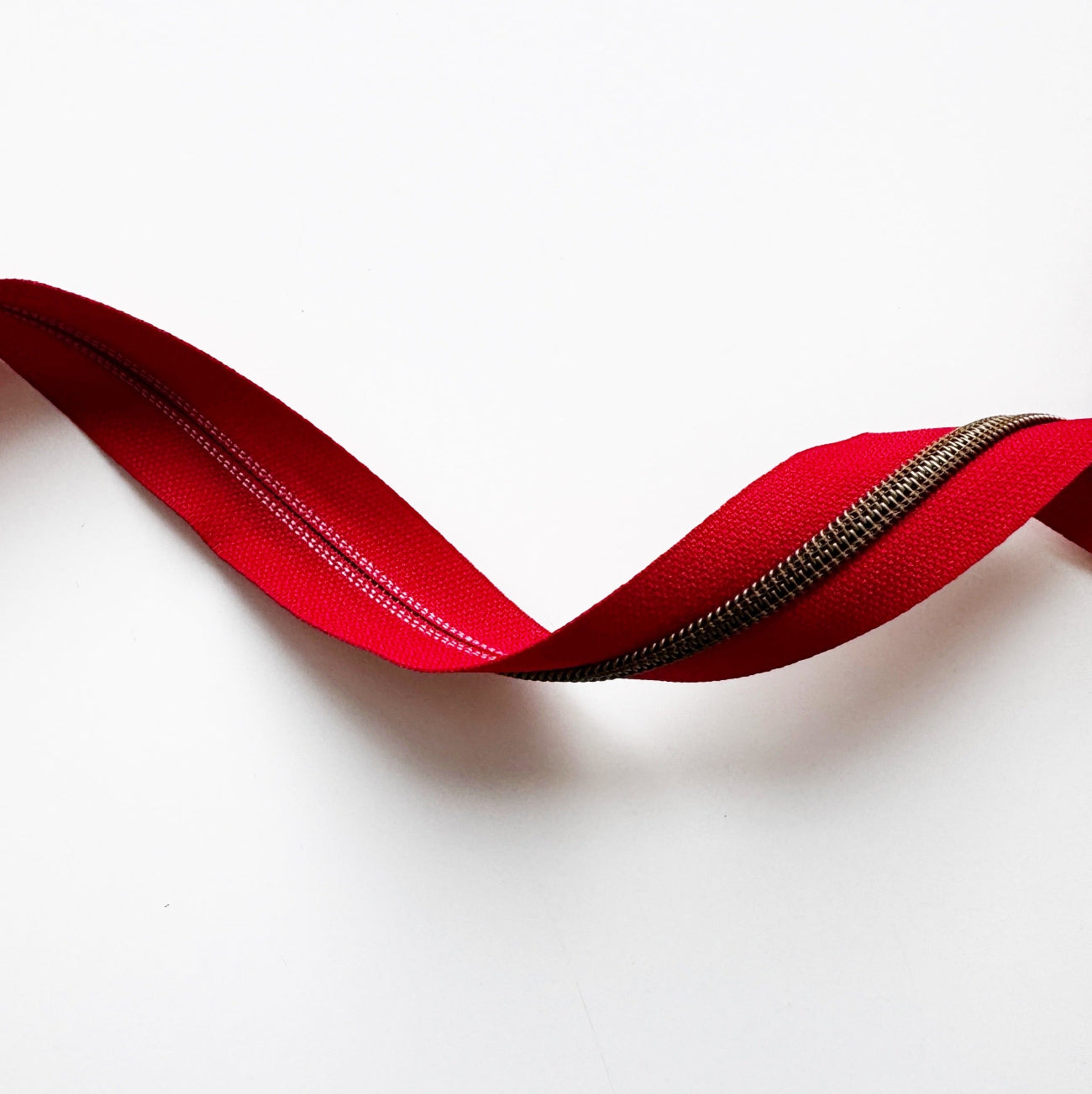 Red zipper on a white background